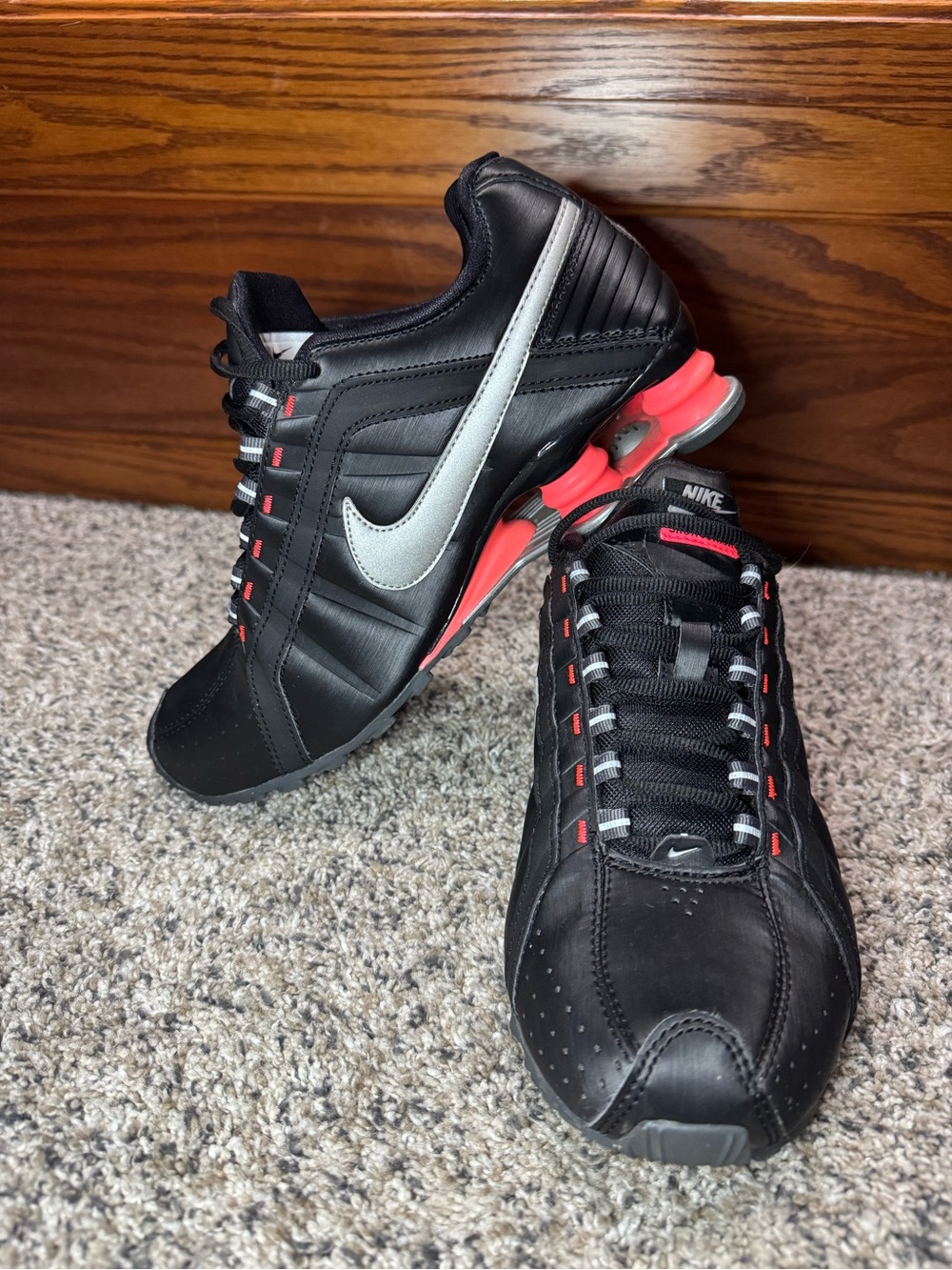 Nike Women’s Black Athletic Sneakers with Silver Swoosh and Coral Accents